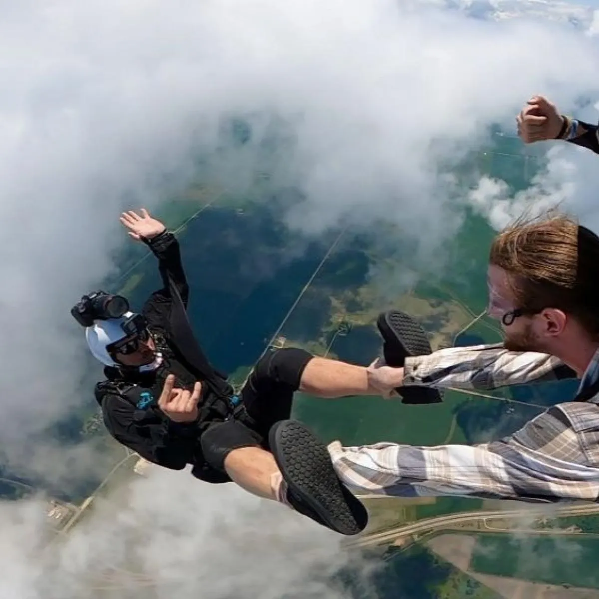Tandem skydivers freefalling above Northwest Illinois