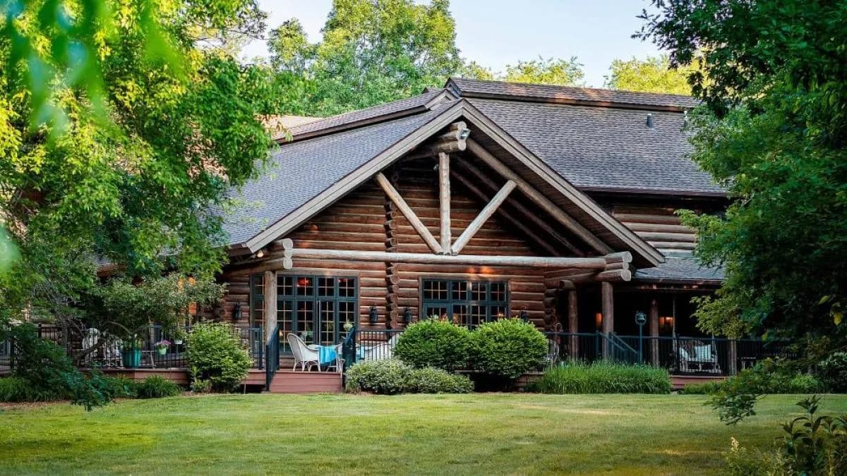 A log lodge on a green lawn in Northwest Illinois